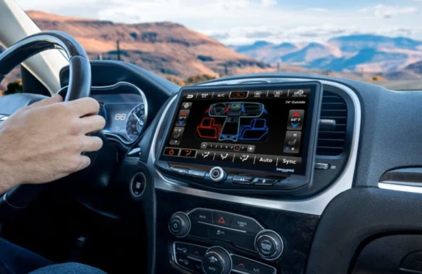 A man is driving a car with a Dodge Challenger (2008-2014) & Dodge Charger (2008-2010) HEIGH10 10" Touch Screen Plug-and-Play Radio Kit gps system.