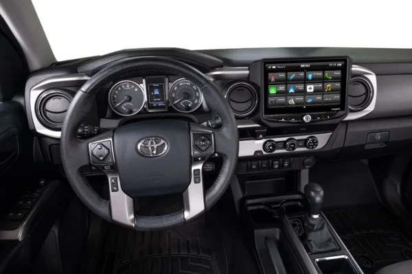 The interior of a Toyota Tacoma (2016-2021) HEIGH10 10" Touch Screen Radio Plug-and-Play Kit.