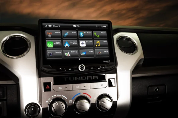 A Toyota Tundra (2014-2021) HEIGH10 10" Touch Screen Radio Plug-and-Play Kit with other devices in the dashboard.